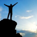 sober-man-on-top-of-mountain