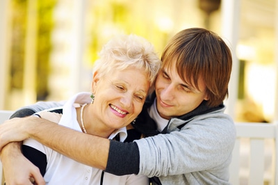 Son hugging his mother.