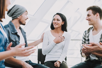 People in a support group.