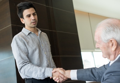 Two men shaking hands.