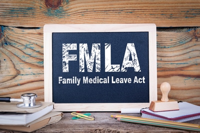 FMLA written on a chalkboard.