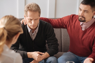 Three people sitting together.