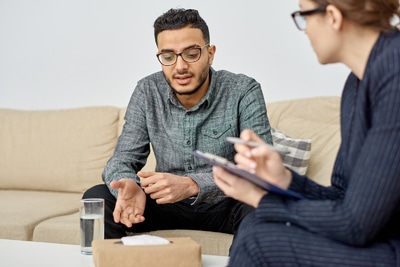 Man speaking with a therapist.