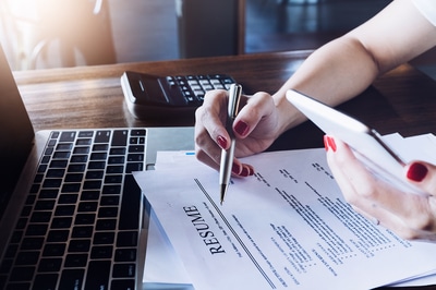 Woman reading a resume.
