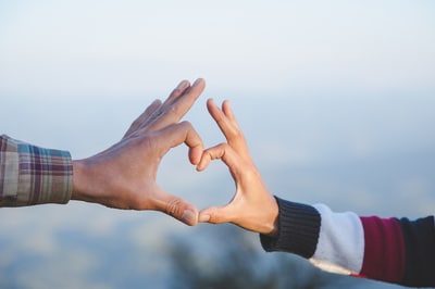 Two hands forming a heart.
