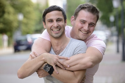 Two men hugging.