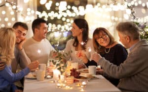Group of people sitting around a dinner table.