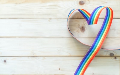 Heart created with a rainbow colored ribbon.
