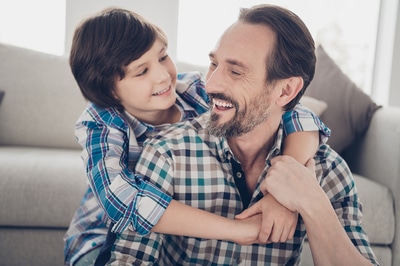 Father smiling at his son.