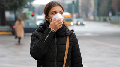 Woman wearing a face mask.