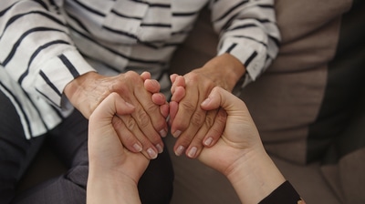 Two people holding hands.
