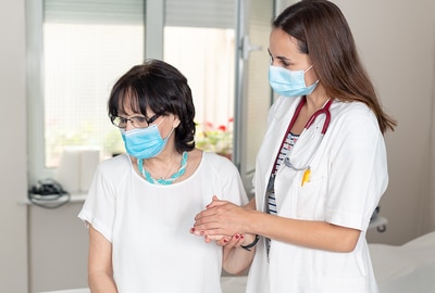 Woman visiting with a medical doctor.