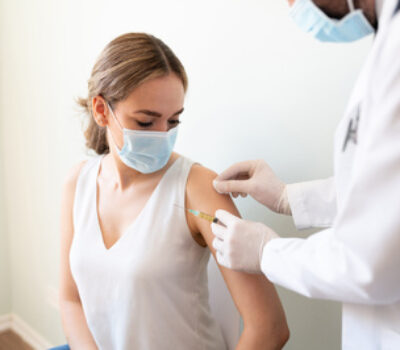 Person getting a covid-19 vaccination